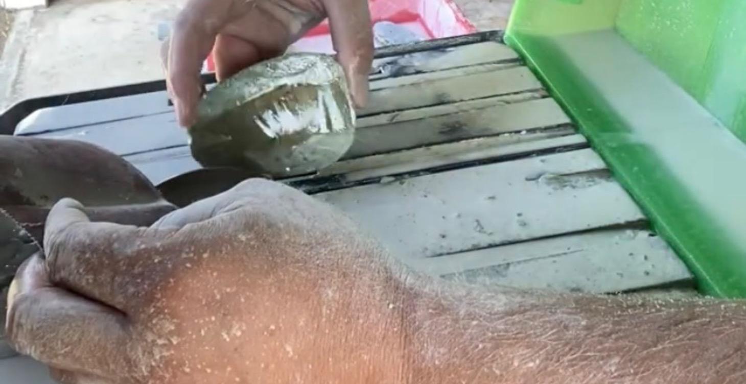 Preparing pounamu stone for Carving