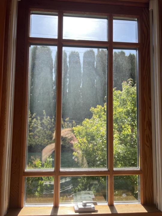 Any comments on possible reasons for the hazy area of this window that appears under direct sunlight? We cleaned it this morning and it looked crystal clean. Possible hard water stains? The window is double paned.