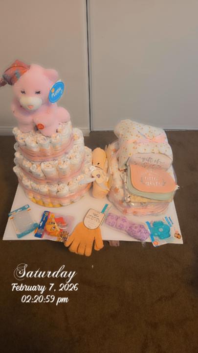 Diaper cake and basinet