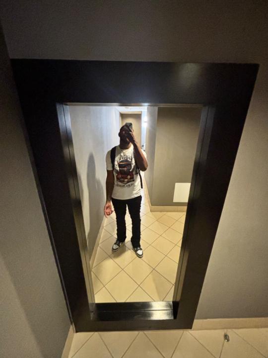 T J
