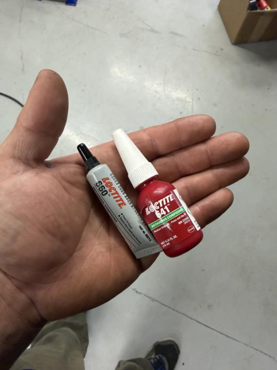 Expansion plug retaining compound