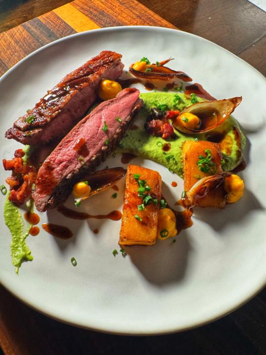 Sous Vide Duck Breast with Sweet Potato Purée, Bacon–Onion Jus, Potato Fondant & Creamed Asparagus Sauce