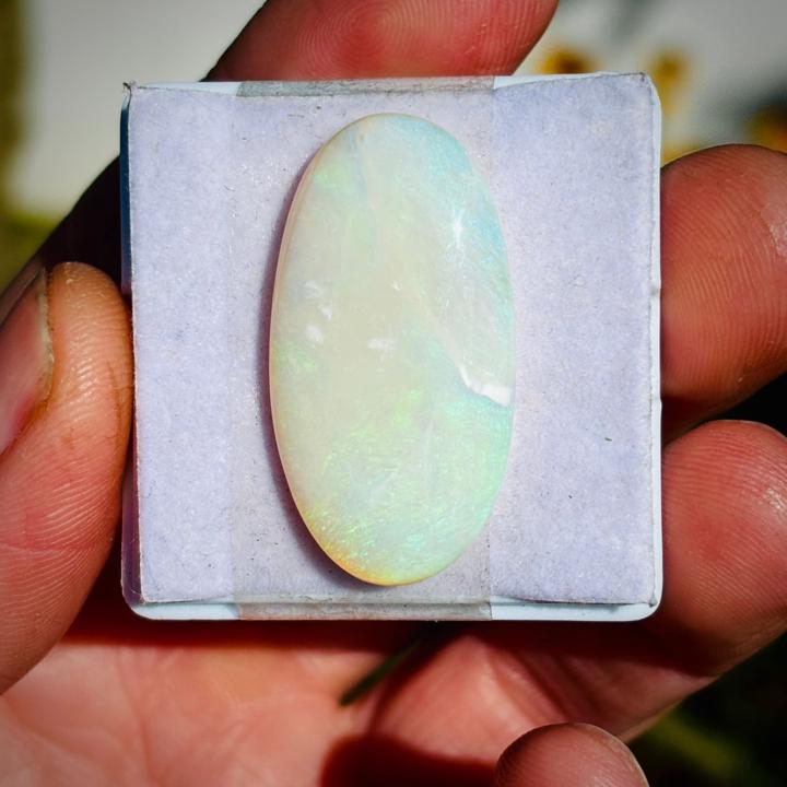 Sorting through milky blue green Opal