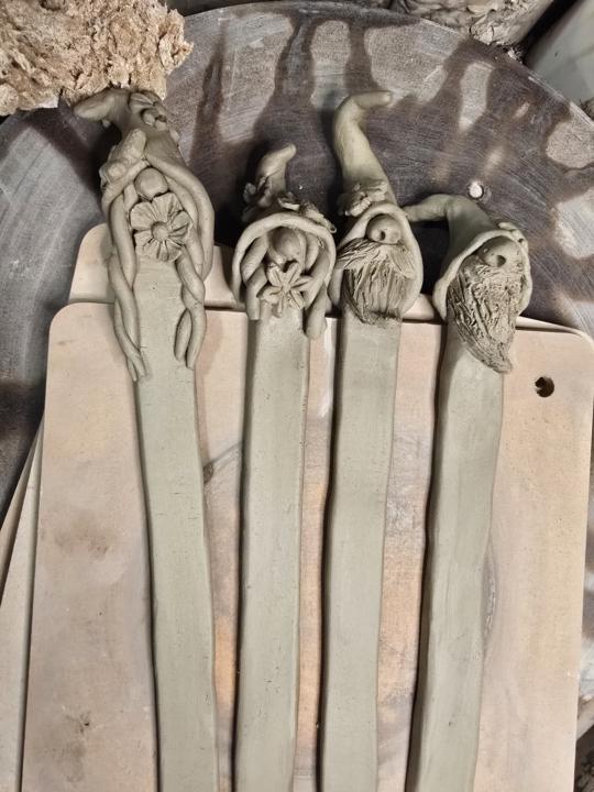 Inspired by Maxine and Denise, I've made some garden stakes a la gnome. They will have a white glaze on the front that allows people to write what's in the row. If you use sharpie it will row off with a little lysol spray.. 