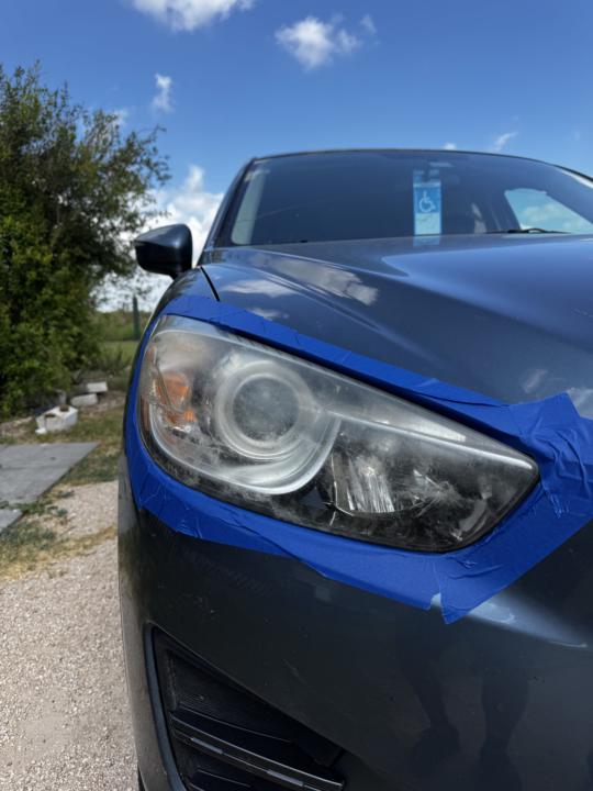 Headlight restoration on a Mazda