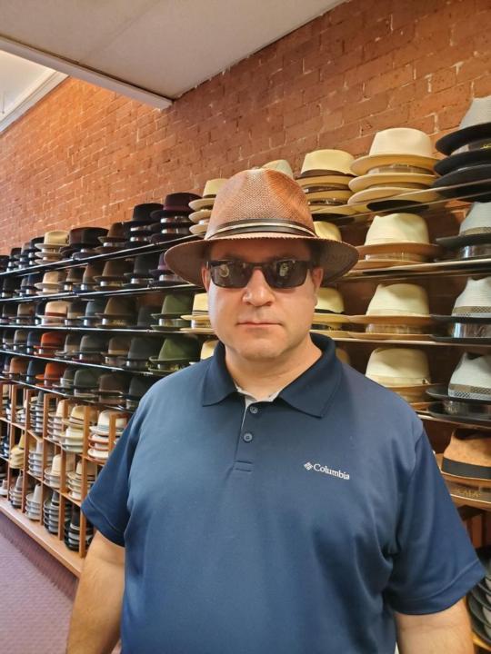 Purchasing a new Panama hat at Del Monica Hatter in New Haven Ct.