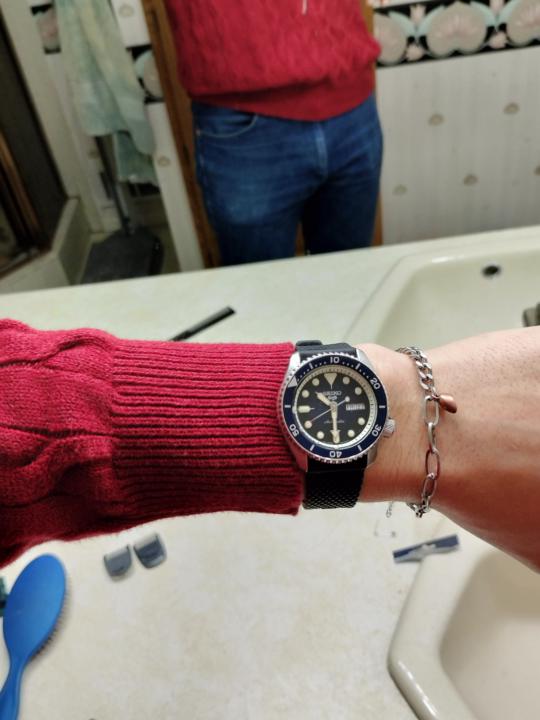 Watch position on a sweater 
