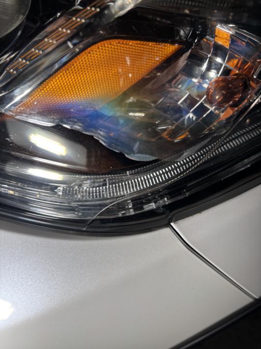 Flaky coating on OEM headlight
