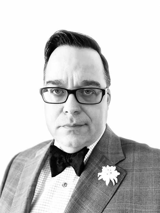 A Sports coat and a butterfly bow tie